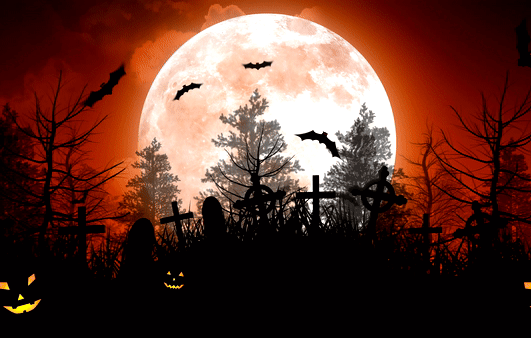 A full moon with bats and trees in the background