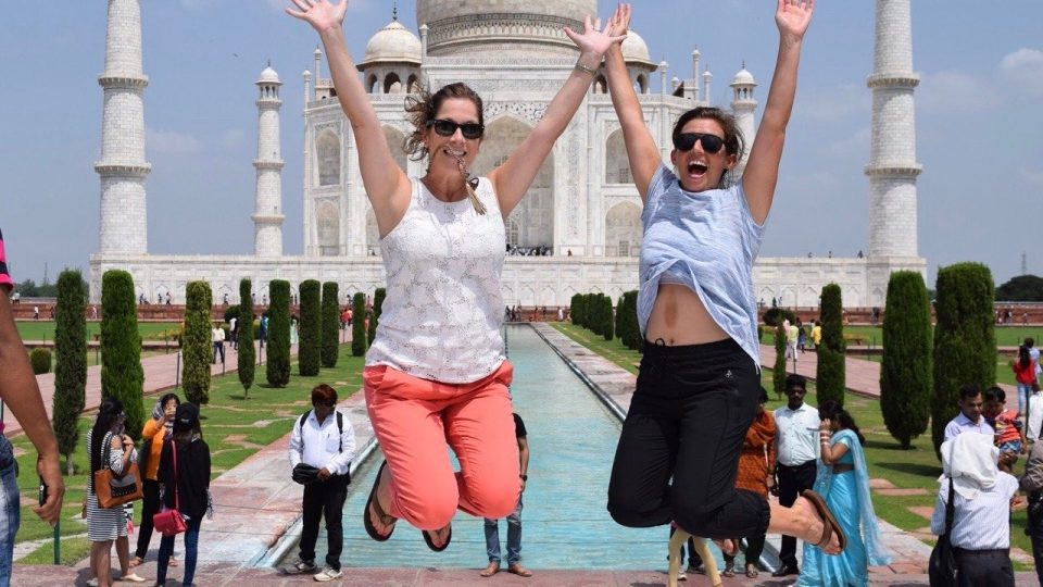 tumblr_ow8uacGUE21uos6fbo1_1280-960x540 Two women jumping in the air near a pool.